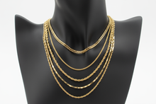 Load image into Gallery viewer, a necklace of gold chains on a black bust with a white background