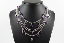 Load image into Gallery viewer, a necklace of silver chains with purple colored and charms on a black bust with a white background