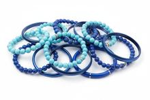 Load image into Gallery viewer, shades of blue bracelets, consisting of elastic, cuff and bangle styles, clustered together with a white background