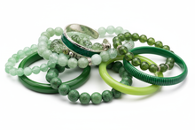 Load image into Gallery viewer, shades of green bracelets, consisting of elastic, cuff and bangle styles, clustered together with a white background