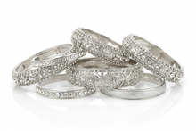 Load image into Gallery viewer, silver and bling bracelets, consisting of elastic, hinge and bangle styles, clustered together with a white background