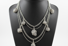 Load image into Gallery viewer, a necklace of silver chains with GRAY colored STONES on a black faux leather jewelry display bust with a white background
